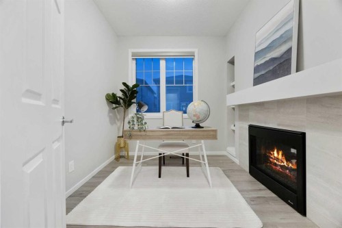 567 Osborne Drive Sw, Airdrie, AB - Indoor With Fireplace