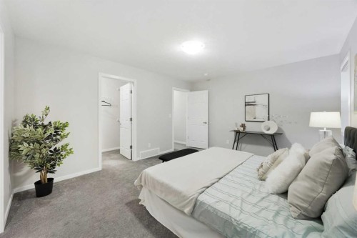 567 Osborne Drive Sw, Airdrie, AB - Indoor Photo Showing Bedroom