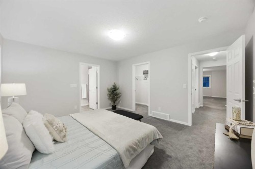 567 Osborne Drive Sw, Airdrie, AB - Indoor Photo Showing Bedroom