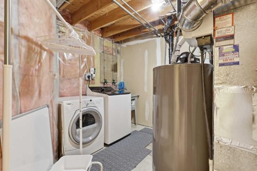310 Hawkstone Manor Nw, Calgary, AB - Indoor Photo Showing Laundry Room