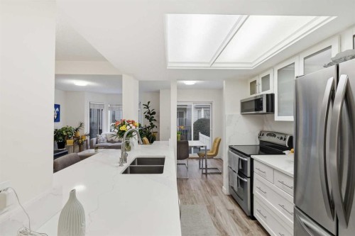 310 Hawkstone Manor Nw, Calgary, AB - Indoor Photo Showing Kitchen With Double Sink With Upgraded Kitchen