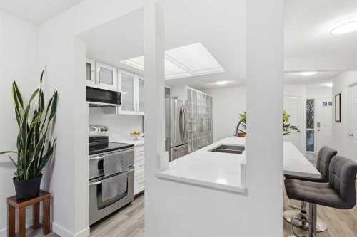310 Hawkstone Manor Nw, Calgary, AB - Indoor Photo Showing Kitchen With Double Sink