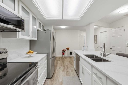 310 Hawkstone Manor Nw, Calgary, AB - Indoor Photo Showing Kitchen With Double Sink With Upgraded Kitchen