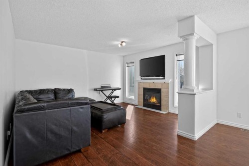 268 Westmount Crescent, Okotoks, AB - Indoor Photo Showing Living Room With Fireplace