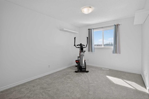268 Westmount Crescent, Okotoks, AB - Indoor Photo Showing Gym Room