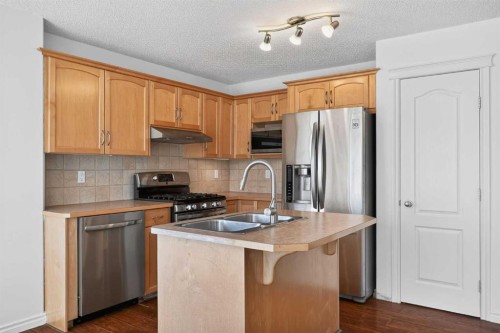 268 Westmount Crescent, Okotoks, AB - Indoor Photo Showing Kitchen With Double Sink