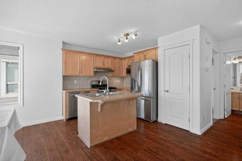 268 Westmount Crescent, Okotoks, AB - Indoor Photo Showing Kitchen With Double Sink