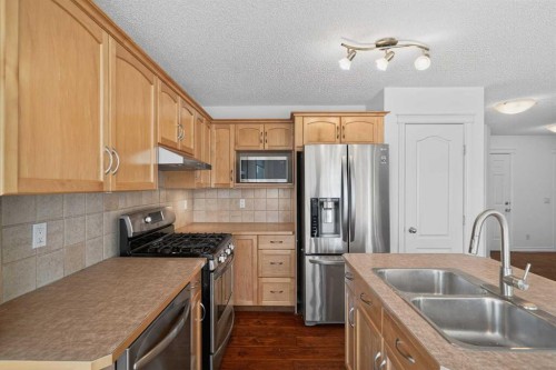 268 Westmount Crescent, Okotoks, AB - Indoor Photo Showing Kitchen With Double Sink