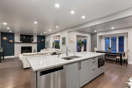 9915 Patton Road Sw, Calgary, AB - Indoor Photo Showing Kitchen With Fireplace With Double Sink With Upgraded Kitchen