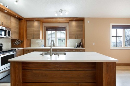 2201-230 Eversyde Boulevard Sw, Calgary, AB - Indoor Photo Showing Kitchen With Double Sink