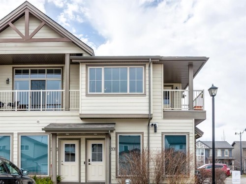 2201-230 Eversyde Boulevard Sw, Calgary, AB - Outdoor With Facade