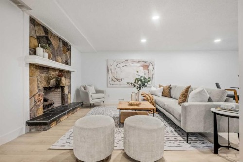 235 Lake Rosen Crescent Se, Calgary, AB - Indoor Photo Showing Living Room With Fireplace