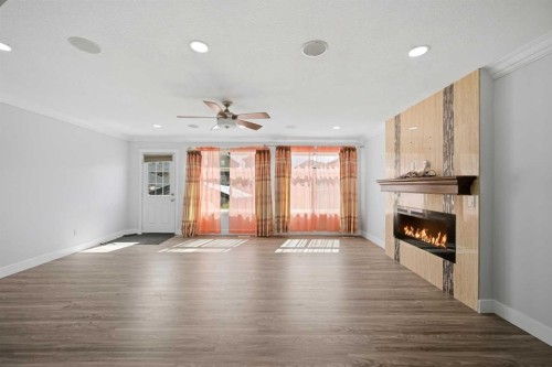 256 Saddlecrest Boulevard Ne, Calgary, AB - Indoor With Fireplace