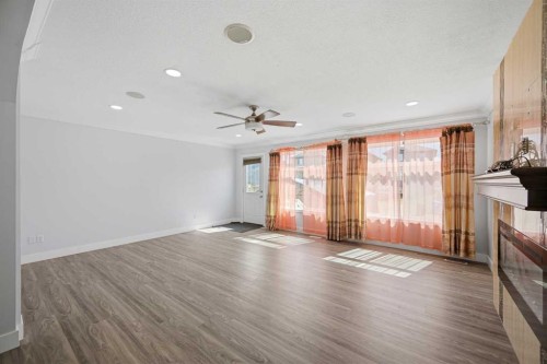 256 Saddlecrest Boulevard Ne, Calgary, AB - Indoor With Fireplace