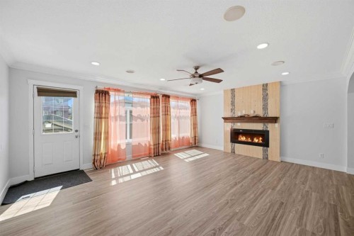 256 Saddlecrest Boulevard Ne, Calgary, AB - Indoor Photo Showing Living Room With Fireplace