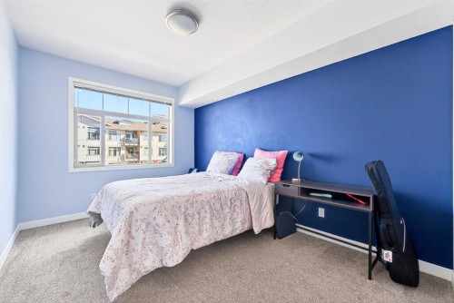 301-16 Auburn Bay Link Se, Calgary, AB - Indoor Photo Showing Bedroom