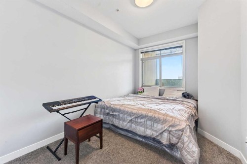 301-16 Auburn Bay Link Se, Calgary, AB - Indoor Photo Showing Bedroom