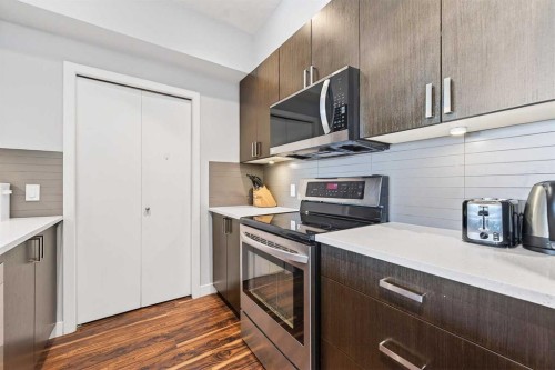 301-16 Auburn Bay Link Se, Calgary, AB - Indoor Photo Showing Kitchen