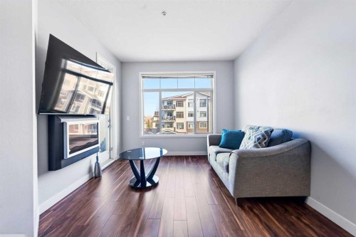 301-16 Auburn Bay Link Se, Calgary, AB - Indoor Photo Showing Living Room
