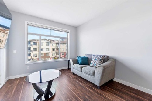 301-16 Auburn Bay Link Se, Calgary, AB - Indoor Photo Showing Living Room