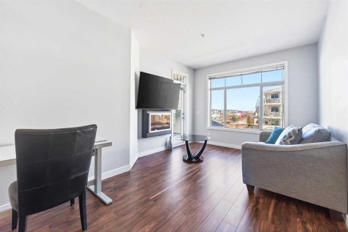 301-16 Auburn Bay Link Se, Calgary, AB - Indoor Photo Showing Living Room