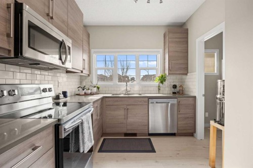 496 Nolan Hill Boulevard Nw, Calgary, AB - Indoor Photo Showing Kitchen With Stainless Steel Kitchen