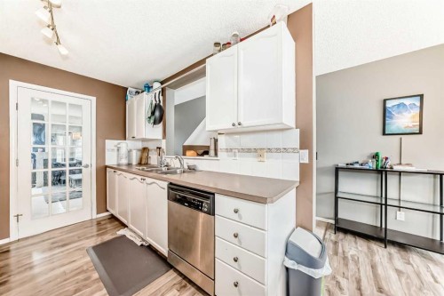 112 Country Village Cape Ne, Calgary, AB - Indoor Photo Showing Kitchen With Double Sink