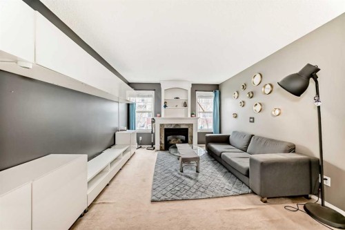 112 Country Village Cape Ne, Calgary, AB - Indoor Photo Showing Living Room With Fireplace