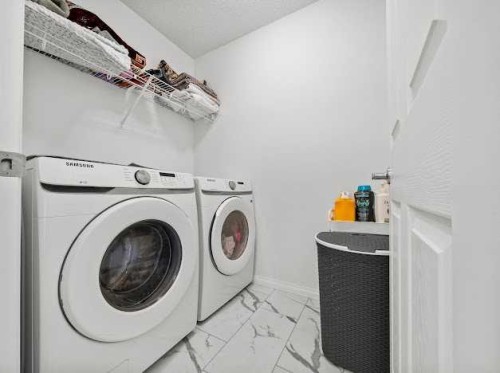136 Lucas Street Nw, Calgary, AB - Indoor Photo Showing Laundry Room