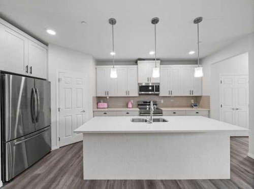 136 Lucas Street Nw, Calgary, AB - Indoor Photo Showing Kitchen With Double Sink With Upgraded Kitchen