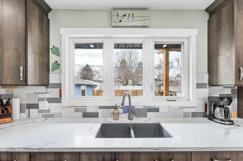 9743 Austin Road Se, Calgary, AB - Indoor Photo Showing Kitchen With Double Sink