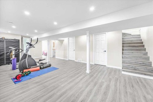 9743 Austin Road Se, Calgary, AB - Indoor Photo Showing Gym Room