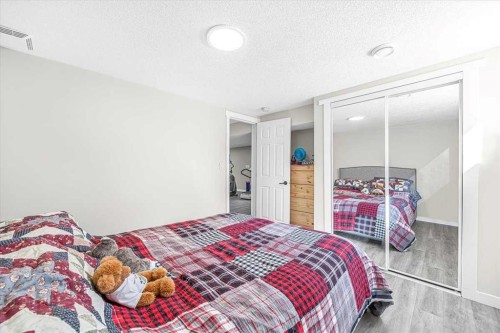 9743 Austin Road Se, Calgary, AB - Indoor Photo Showing Bedroom
