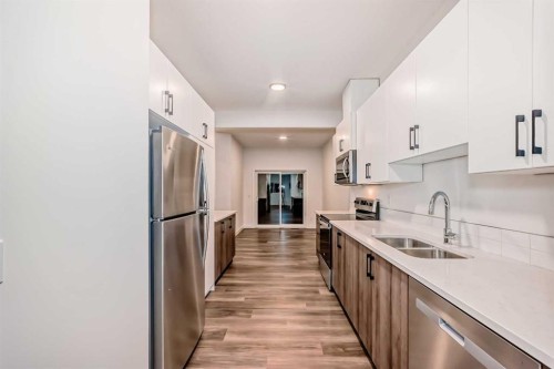 76 Tuscany Summit Square Nw, Calgary, AB - Indoor Photo Showing Kitchen With Stainless Steel Kitchen With Double Sink With Upgraded Kitchen