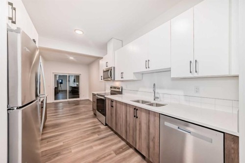 76 Tuscany Summit Square Nw, Calgary, AB - Indoor Photo Showing Kitchen With Stainless Steel Kitchen With Double Sink
