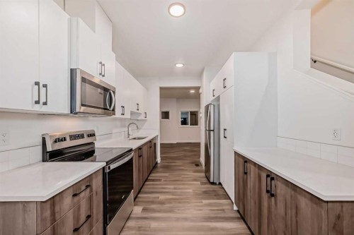 76 Tuscany Summit Square Nw, Calgary, AB - Indoor Photo Showing Kitchen