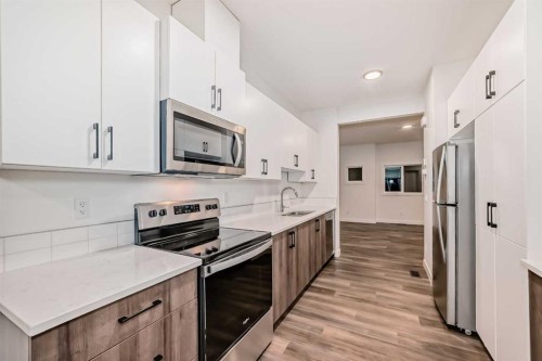 76 Tuscany Summit Square Nw, Calgary, AB - Indoor Photo Showing Kitchen With Stainless Steel Kitchen With Upgraded Kitchen