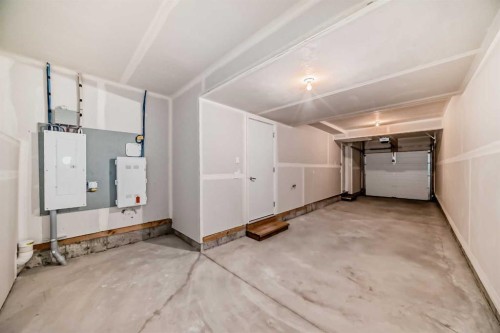 76 Tuscany Summit Square Nw, Calgary, AB - Indoor Photo Showing Garage