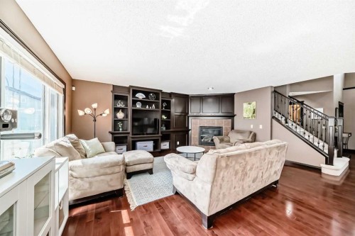 229 Panamount Road Nw, Calgary, AB - Indoor Photo Showing Living Room With Fireplace