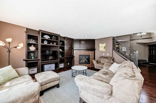 229 Panamount Road Nw, Calgary, AB - Indoor Photo Showing Living Room With Fireplace