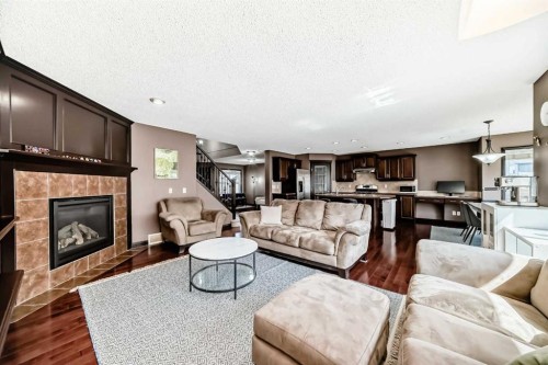 229 Panamount Road Nw, Calgary, AB - Indoor Photo Showing Living Room With Fireplace