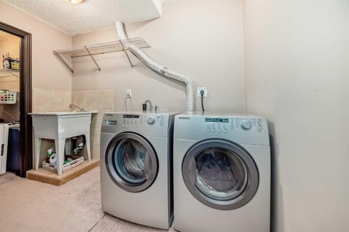229 Panamount Road Nw, Calgary, AB - Indoor Photo Showing Laundry Room