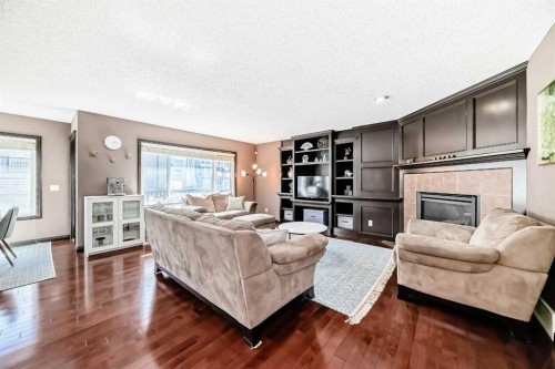 229 Panamount Road Nw, Calgary, AB - Indoor Photo Showing Living Room With Fireplace