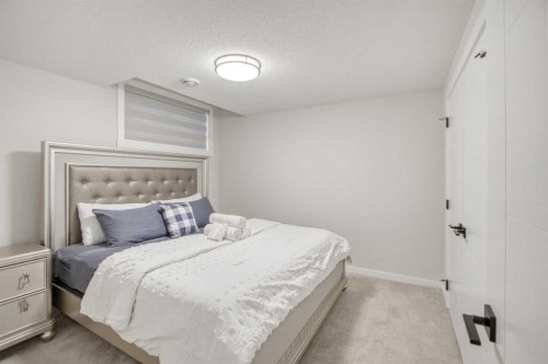 1104 Cranbrook Gardens Se, Calgary, AB - Indoor Photo Showing Bedroom