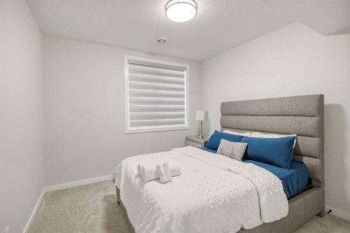 1104 Cranbrook Gardens Se, Calgary, AB - Indoor Photo Showing Bedroom