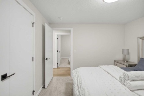 1104 Cranbrook Gardens Se, Calgary, AB - Indoor Photo Showing Bedroom