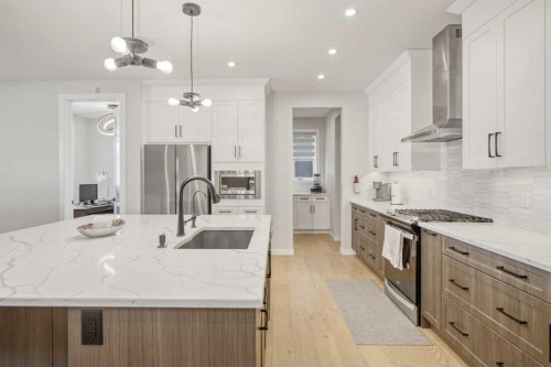 1104 Cranbrook Gardens Se, Calgary, AB - Indoor Photo Showing Kitchen With Upgraded Kitchen
