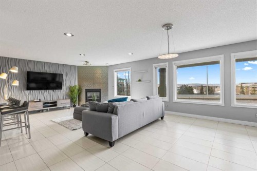 12 Arbour Estates Green Nw, Calgary, AB - Indoor Photo Showing Living Room With Fireplace