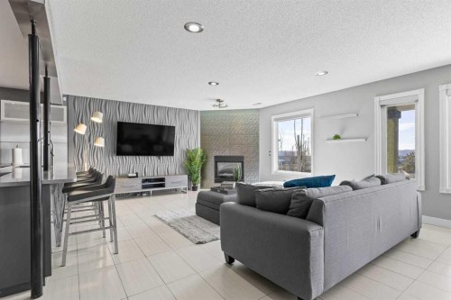 12 Arbour Estates Green Nw, Calgary, AB - Indoor Photo Showing Living Room With Fireplace
