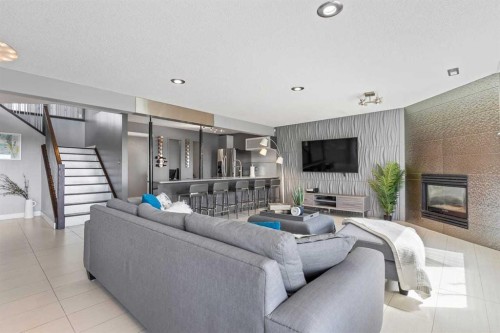 12 Arbour Estates Green Nw, Calgary, AB - Indoor Photo Showing Living Room With Fireplace